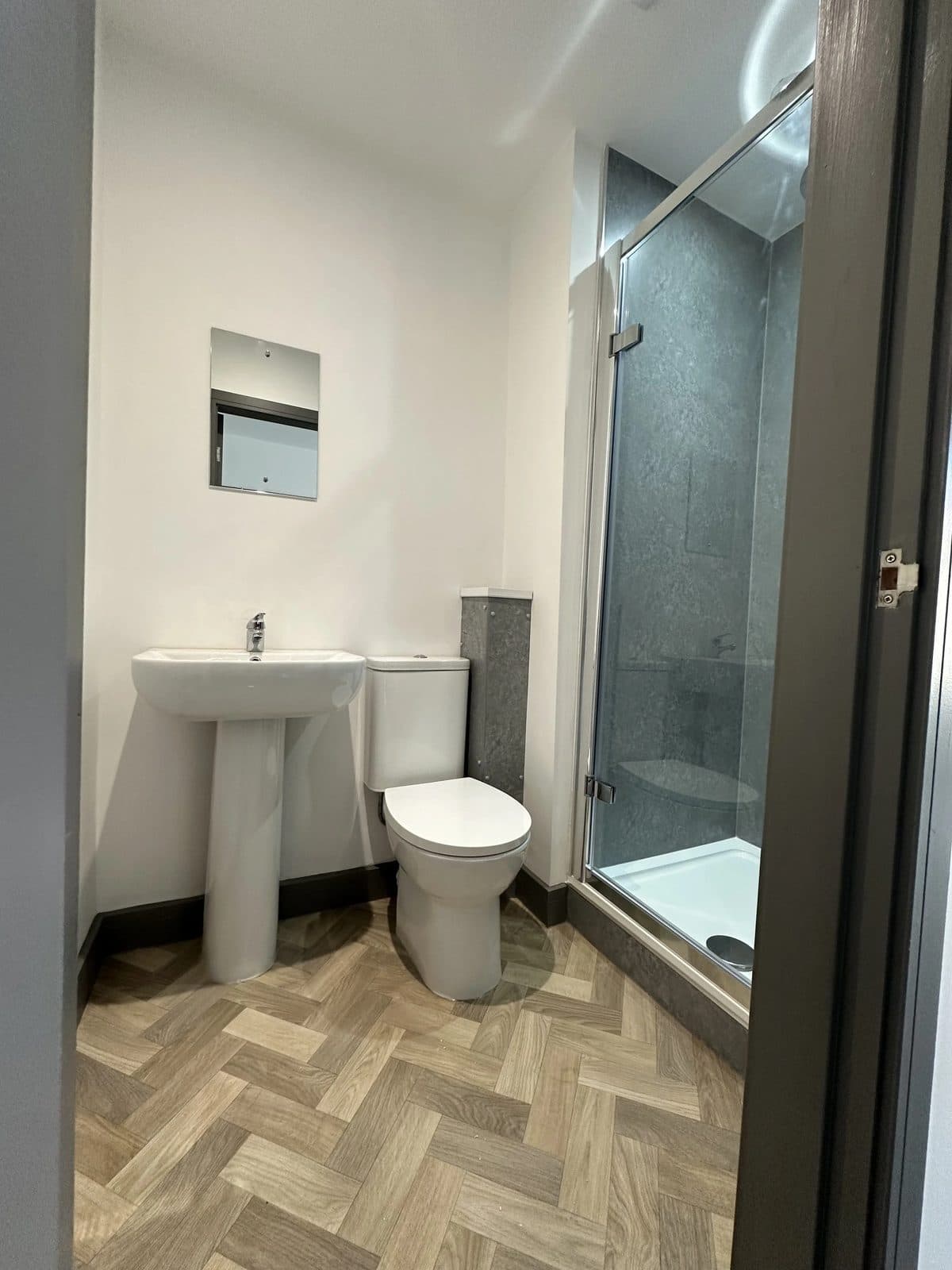 Bedroom with new flooring and natural light