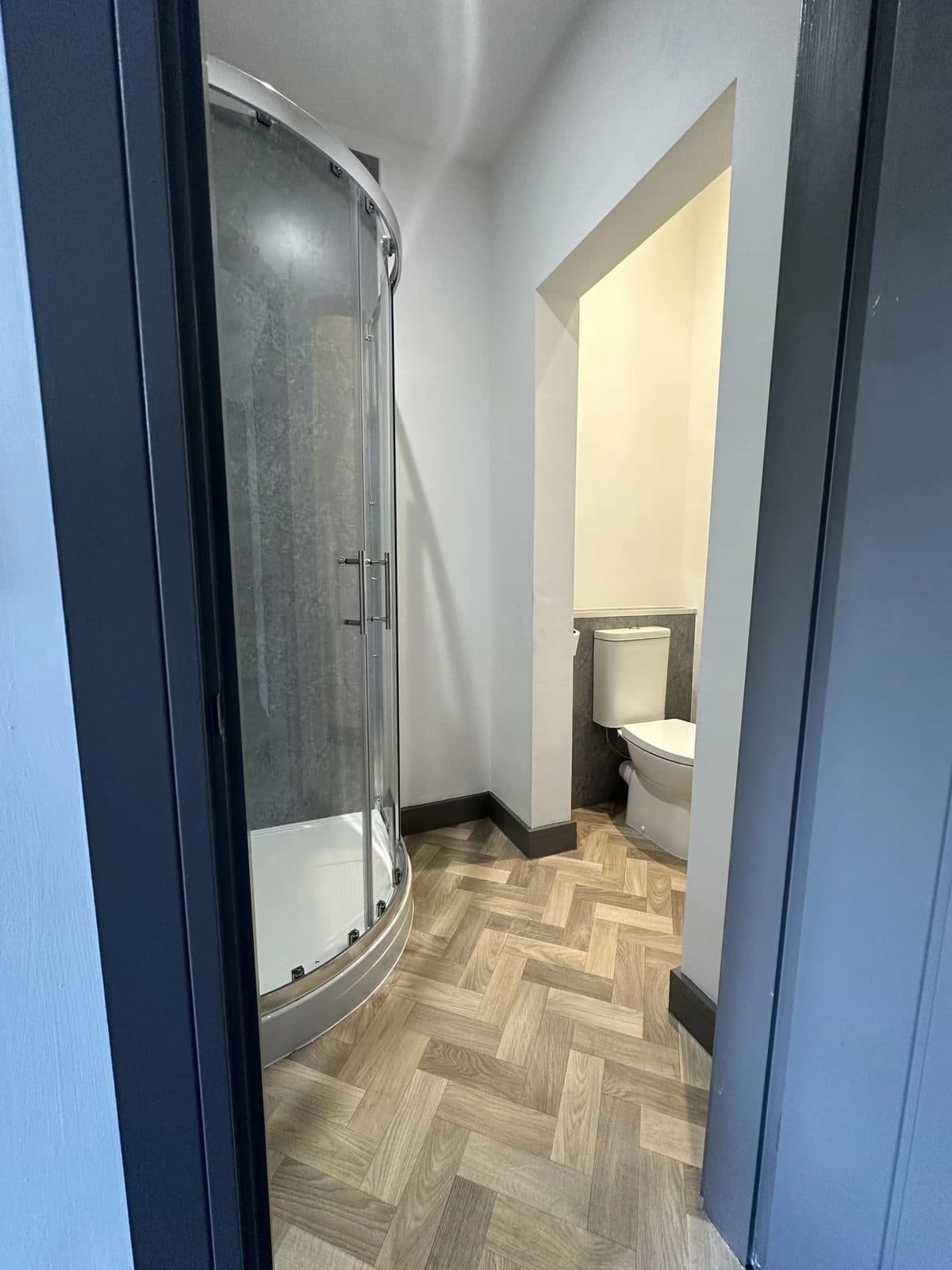 Compact bathroom layout with shower enclosure