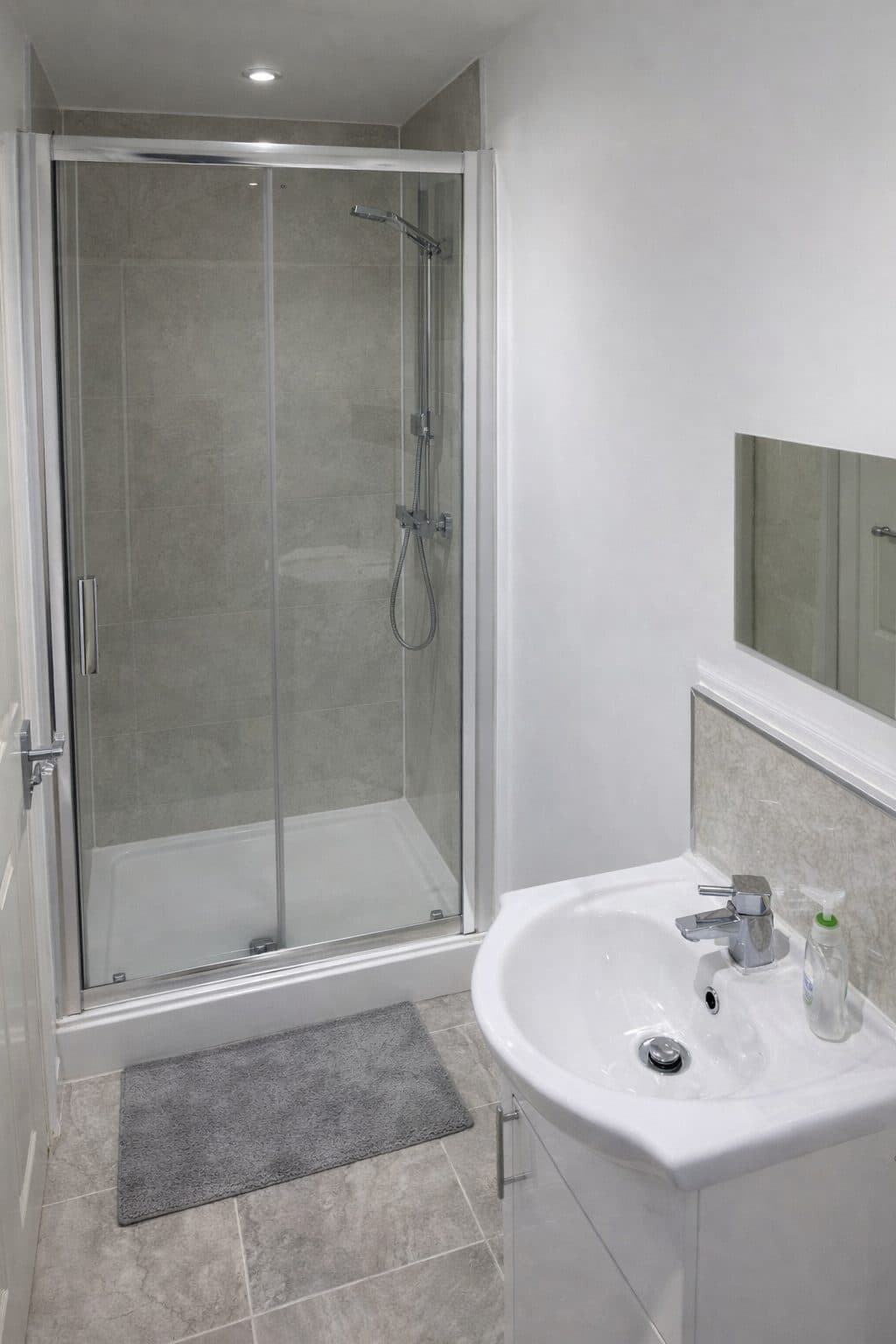 Bathroom with walk-in shower and modern fixtures