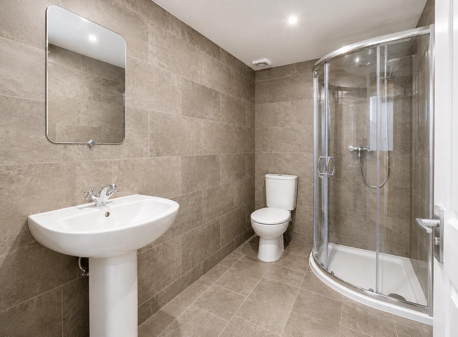 Second bathroom with quadrant shower enclosure, WC and basin